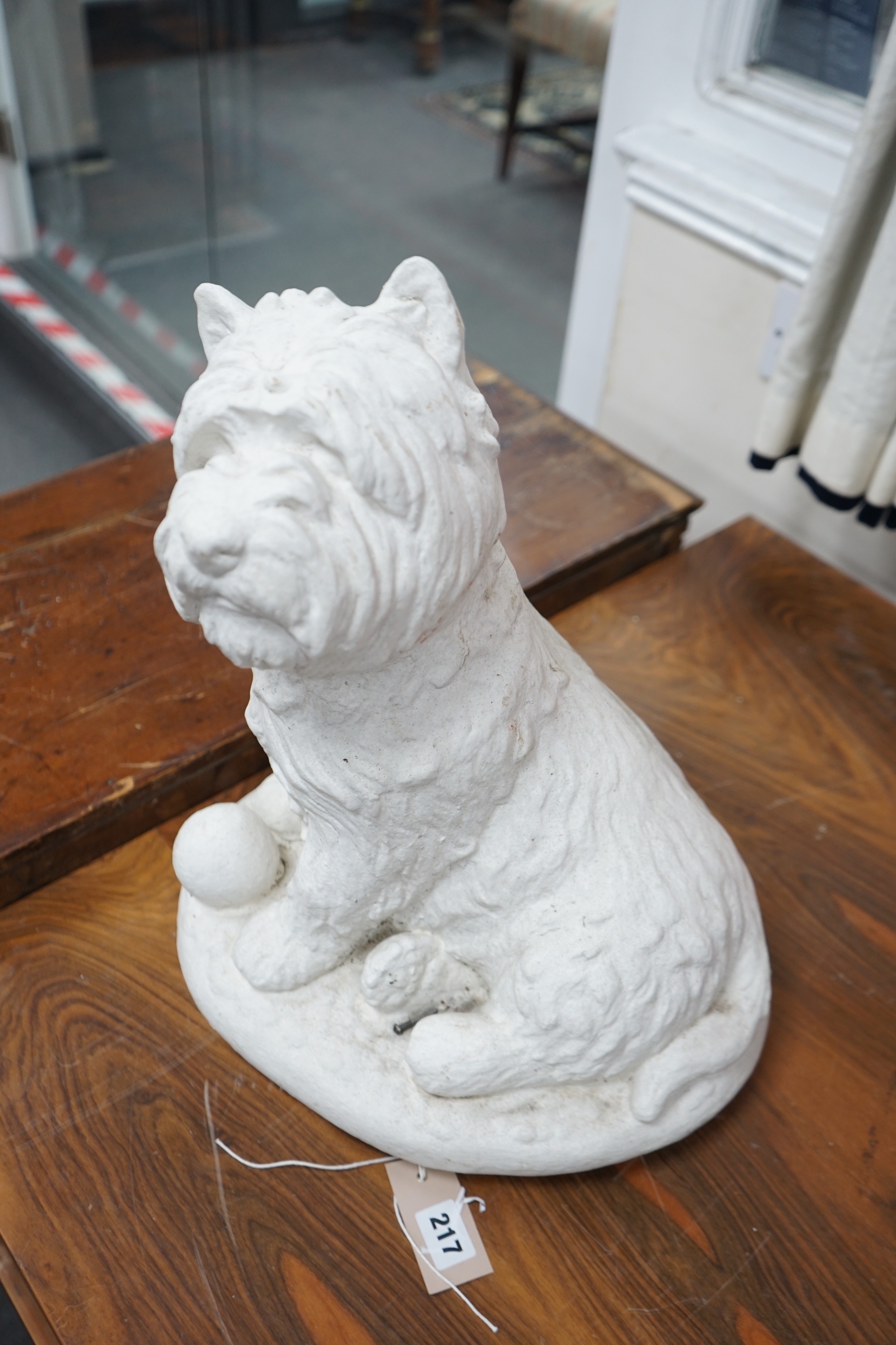 A painted carved stone model of a Scottish terrier, height 46cm